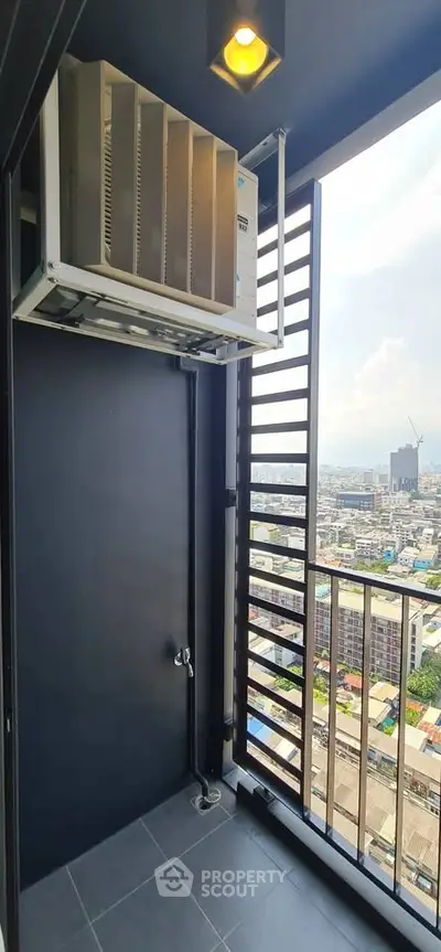 Modern balcony with city view and air conditioning unit, perfect for urban living.