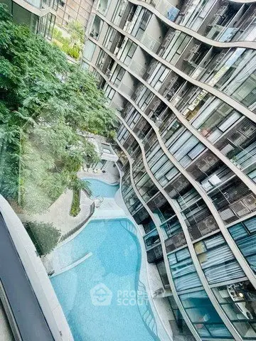 Modern apartment building with unique architecture and pool view