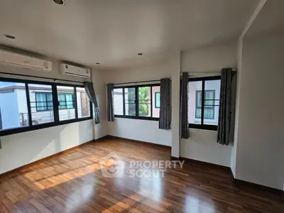 Spacious corner unit with large windows and hardwood floors, perfect for natural light lovers.