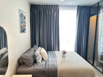 Cozy modern bedroom with elegant curtains and stylish decor