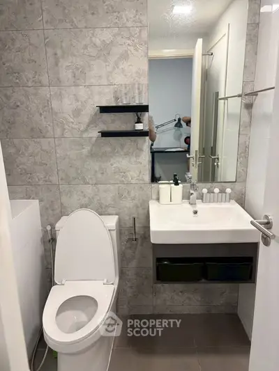 Modern bathroom with sleek fixtures and stylish tile design