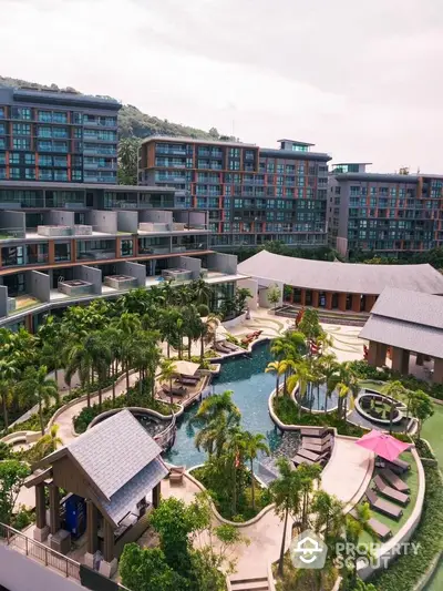 Luxurious resort-style residential complex with lush gardens and inviting pool area.