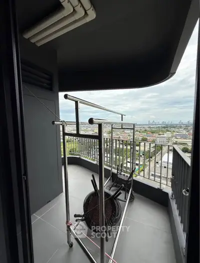 Spacious balcony with city view, perfect for relaxation and enjoying the skyline.