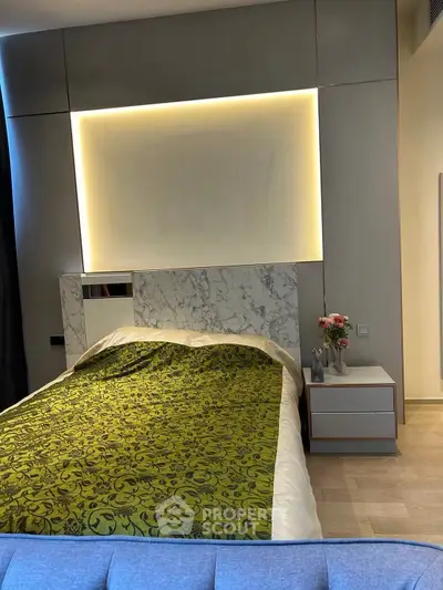 Luxurious bedroom with elegant marble headboard and ambient lighting