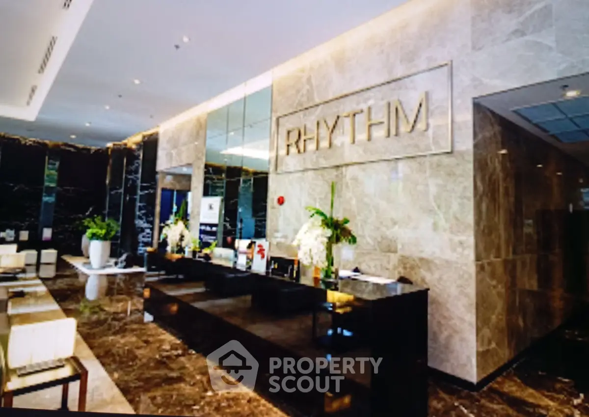 Luxurious building lobby with elegant marble decor and modern design.