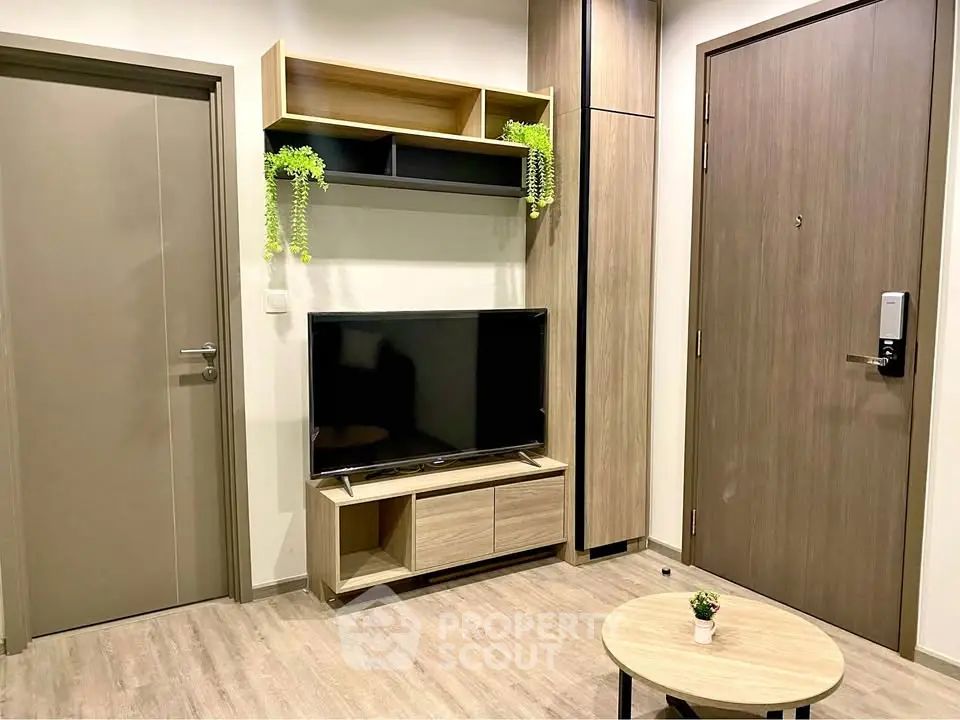 Modern living room with sleek TV stand and wooden accents, perfect for cozy urban living.