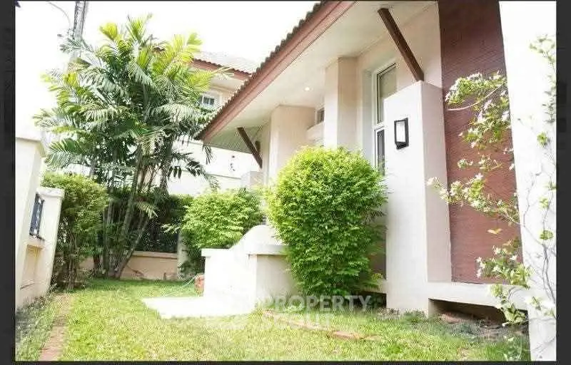 Charming suburban home with lush garden and modern exterior design.