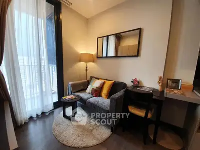 Cozy living room with modern decor and balcony access