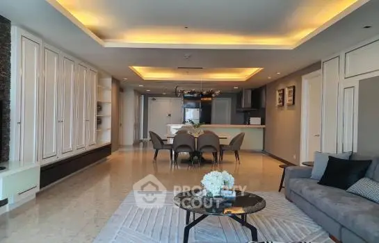 Luxurious open-concept living space with elegant lighting, modern furniture, and a seamless transition to a sophisticated dining area, perfect for entertaining.