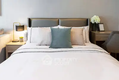 Elegant bedroom with modern decor and cozy bedding