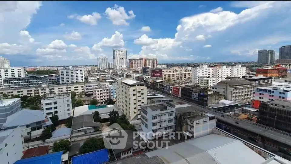 Stunning cityscape view showcasing urban skyline with diverse architecture under a vibrant blue sky.