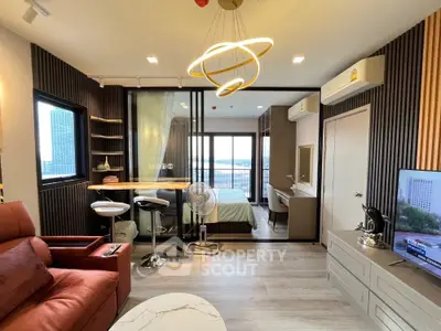 Modern studio apartment with open layout and stylish decor, featuring a cozy living area and bedroom with balcony view.