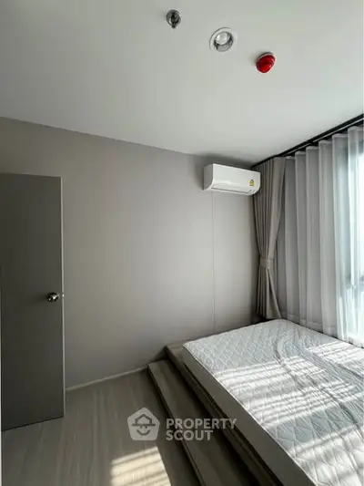 Modern minimalist bedroom with natural light and sleek design