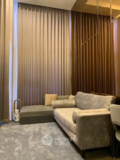 Luxurious living room with elegant curtains and plush sofa