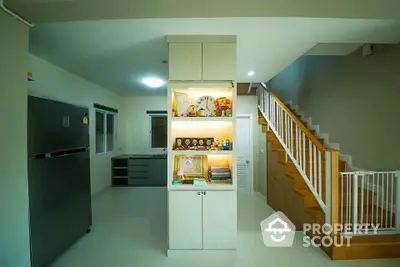 Modern interior with staircase and illuminated display shelf in spacious home