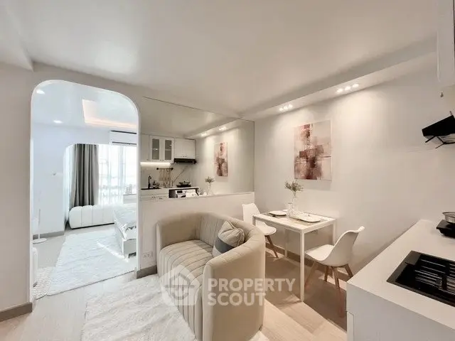 Modern open-plan living room with cozy seating and stylish decor