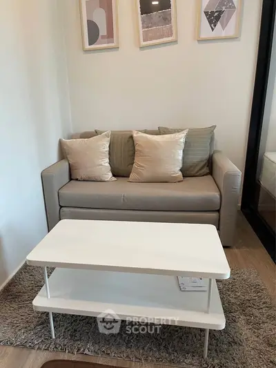 Cozy living room with modern sofa and stylish coffee table, perfect for relaxation and comfort.