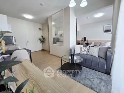 Modern living room with stylish decor and cozy seating area, perfect for relaxation and entertaining.