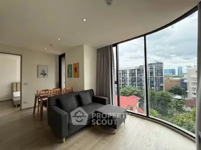 Spacious living room with panoramic city view and modern furnishings