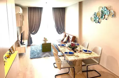 Modern living room with elegant dining area and stylish decor