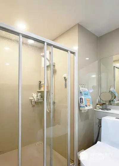 Modern bathroom with glass shower and sleek fixtures