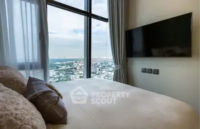Luxurious bedroom with stunning city view and modern amenities