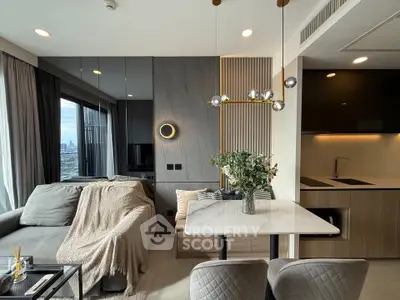 Modern living room with stylish decor and city view, featuring a cozy sofa and elegant dining area.
