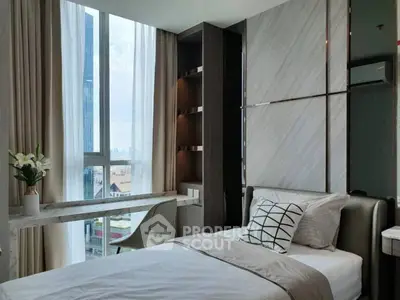 Modern bedroom with city view, sleek design, and elegant decor in a high-rise apartment.