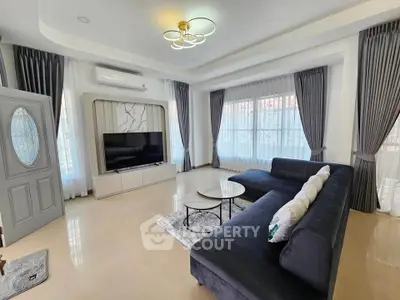 Spacious modern living room with elegant decor and large windows