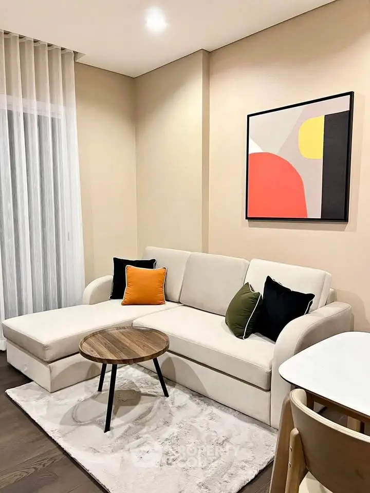 Modern living room with stylish sofa and abstract art, perfect for cozy relaxation.