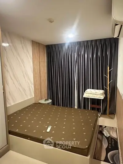 Cozy bedroom with modern decor and elegant curtains