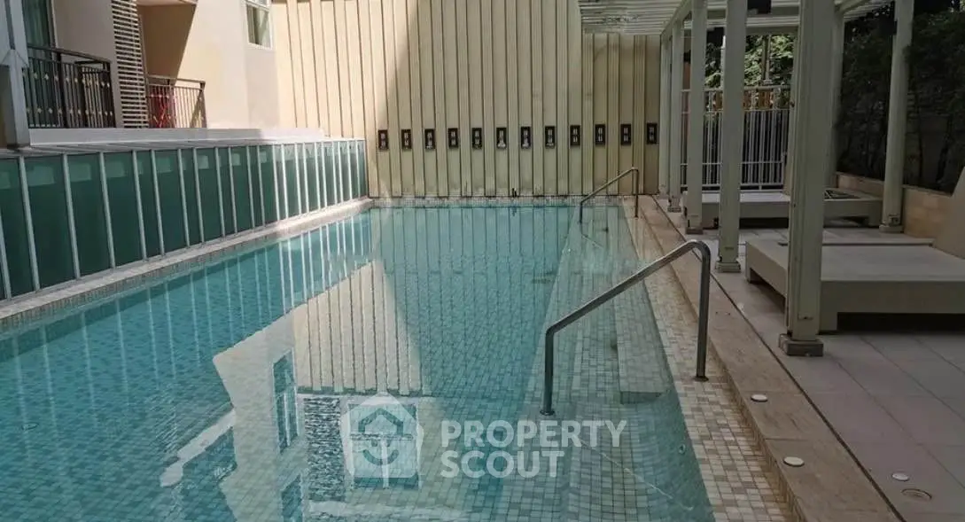 Luxurious outdoor swimming pool with modern design and serene ambiance