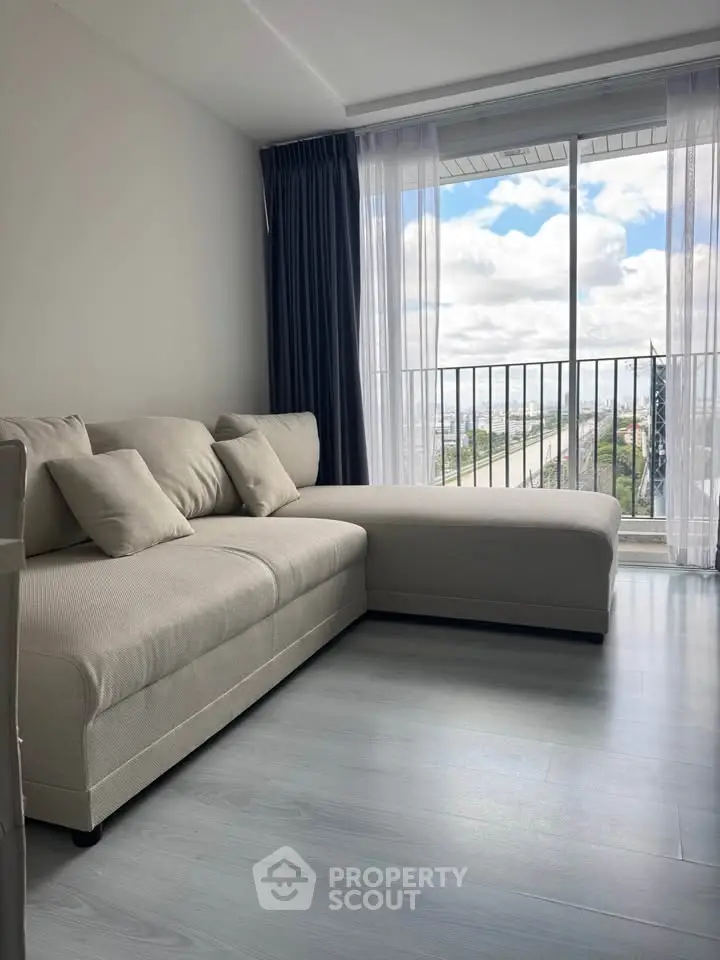 Modern living room with cozy sofa and stunning balcony view
