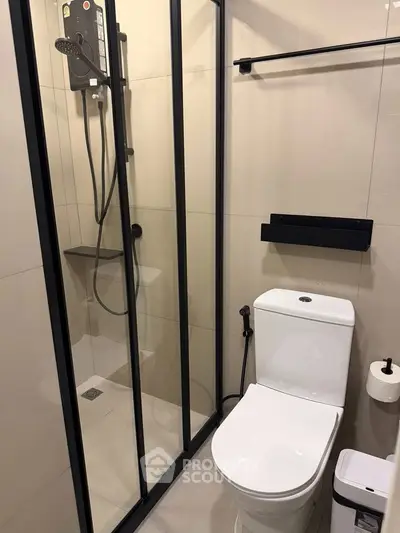 Modern bathroom with sleek shower and toilet design