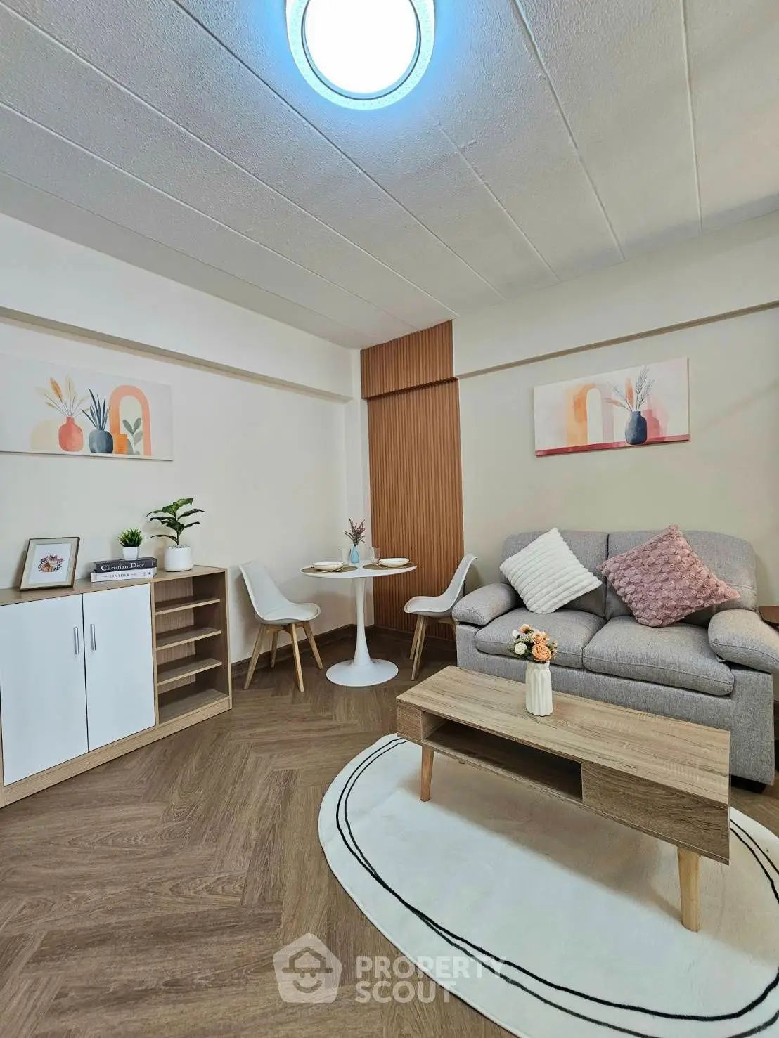 Charming living room with modern decor, cozy seating, and stylish furniture, perfect for relaxation and entertaining.
