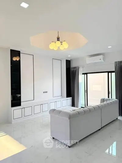 Spacious modern living room with elegant ceiling lights and large sofa
