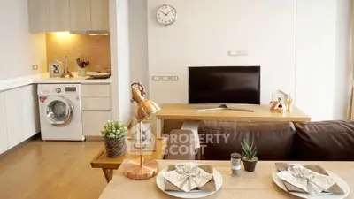Modern living room with open kitchen and stylish decor