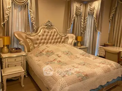 Luxurious bedroom with elegant decor and ornate bed frame