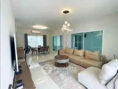 Spacious modern living room with elegant lighting and comfortable seating