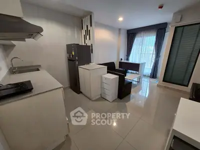 Modern open-layout kitchen and living area with sleek design