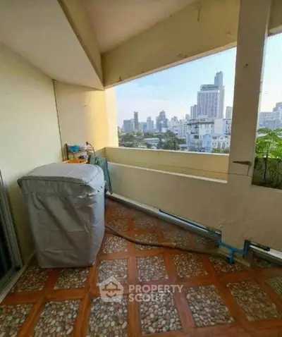 Charming balcony with city view, perfect for relaxation and enjoying urban skyline.