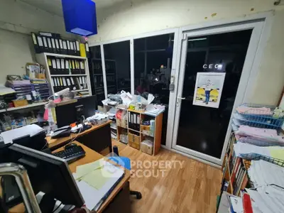 Cozy home office with ample storage and natural light, perfect for productivity and organization.