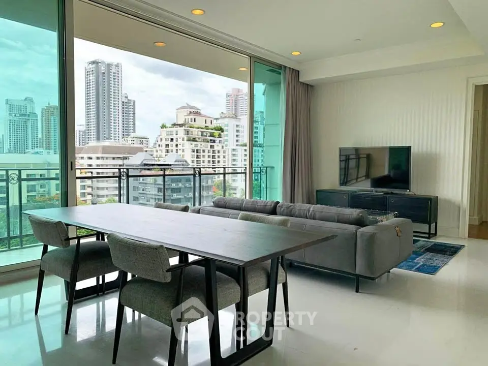 Spacious modern living room with city view and elegant furnishings.