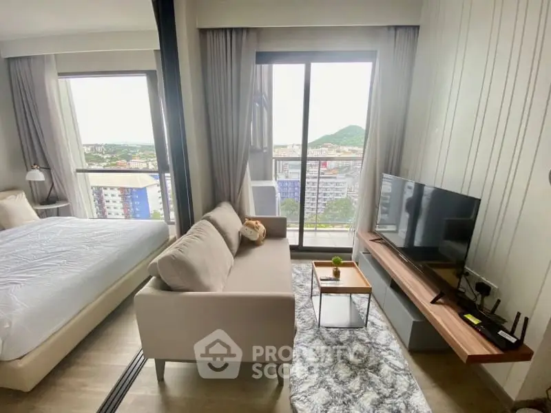 Modern apartment with cozy living area and scenic balcony view