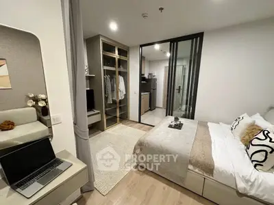 Modern bedroom with open closet and cozy decor in stylish apartment