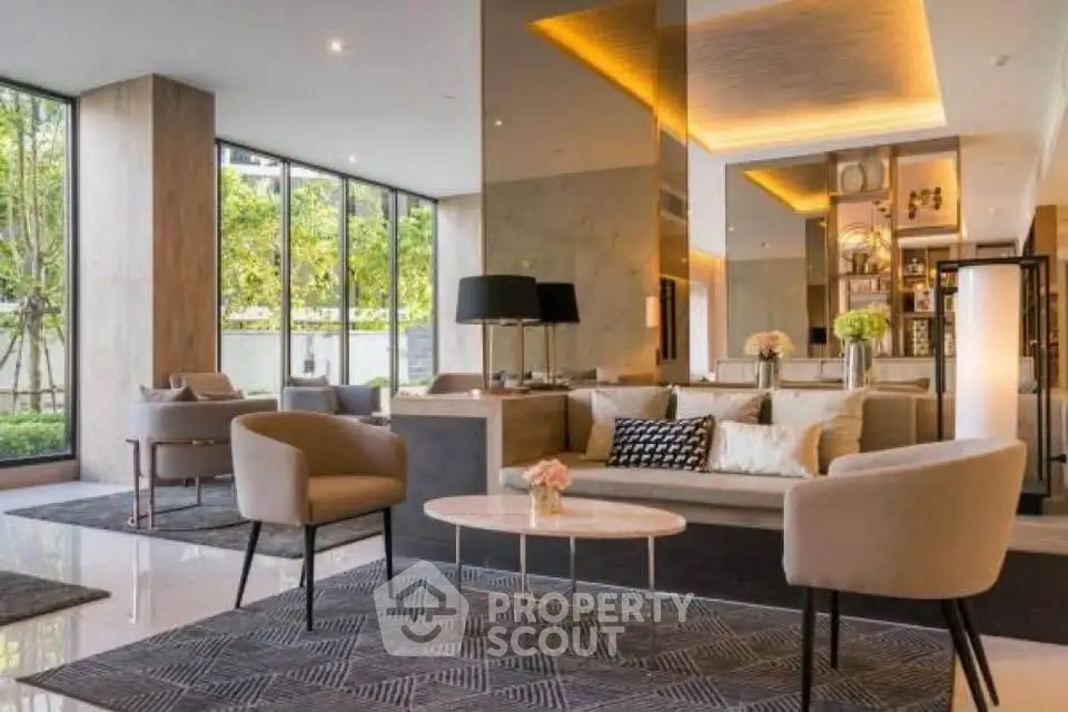Luxurious modern living room with elegant decor and large windows offering garden views.