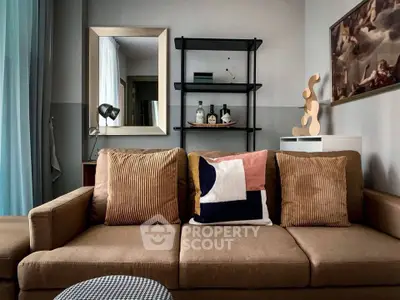 Stylish living room with modern decor and cozy sofa, perfect for relaxation.