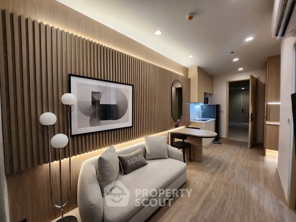 Modern living room with stylish decor and cozy seating in a contemporary apartment.