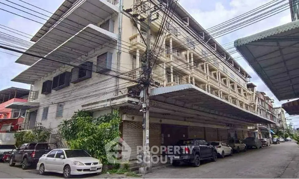 Spacious multi-story building with ample parking in urban setting