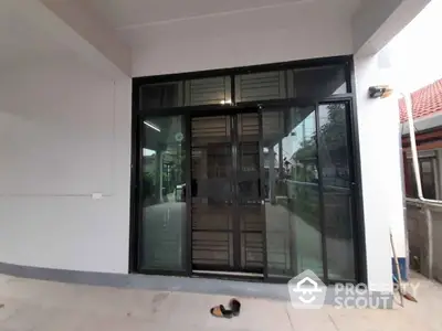 Modern building entrance with glass doors and sleek design